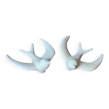 Pair of plaster swallows