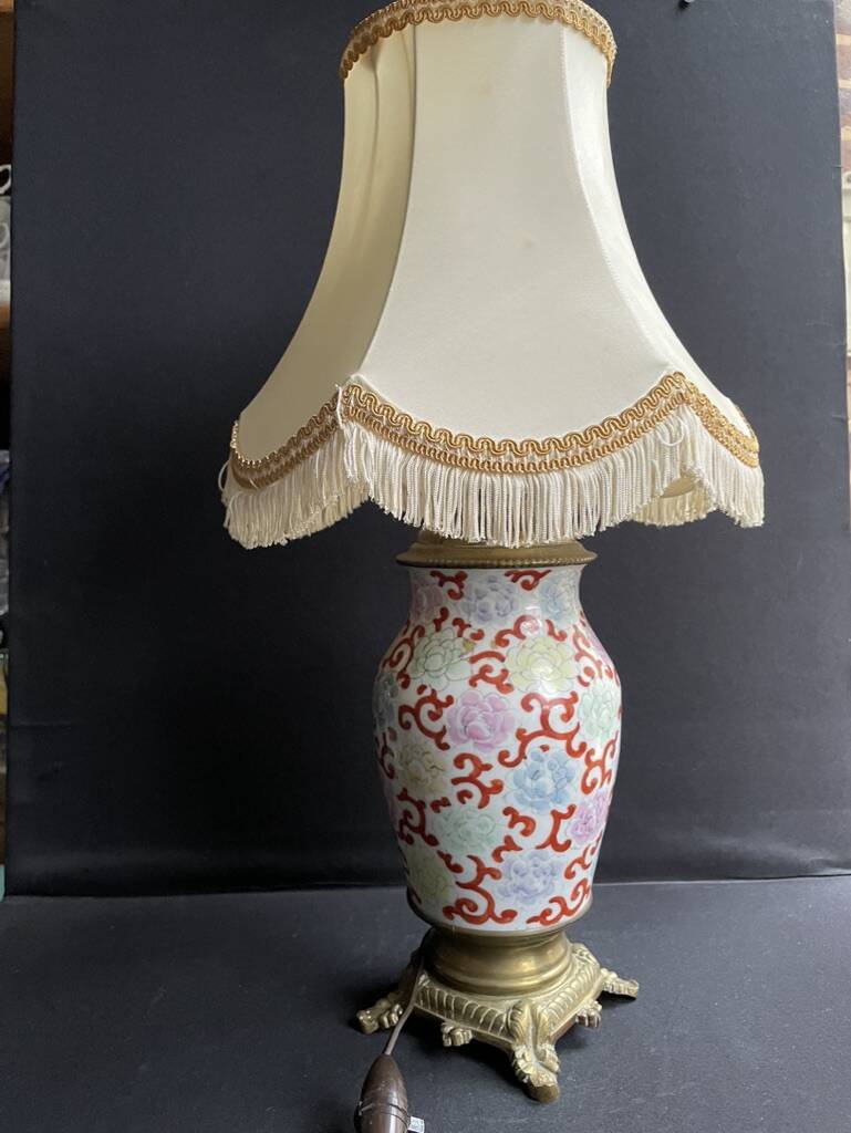 Old Asian vase mounted as a lamp with pagoda lampshade