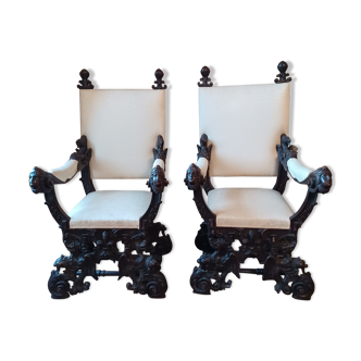 Pair of 19th century ceremonial armchairs in carved wood neo-renaissance style