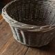 Round wicker basket with a patina