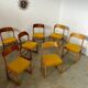 Set of 7 Baumann sled chairs in wood and mustard yellow fabric, 1960s