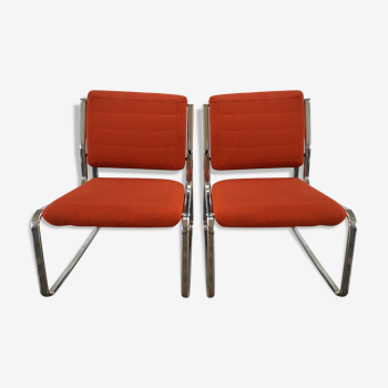 Two orange  low chairs