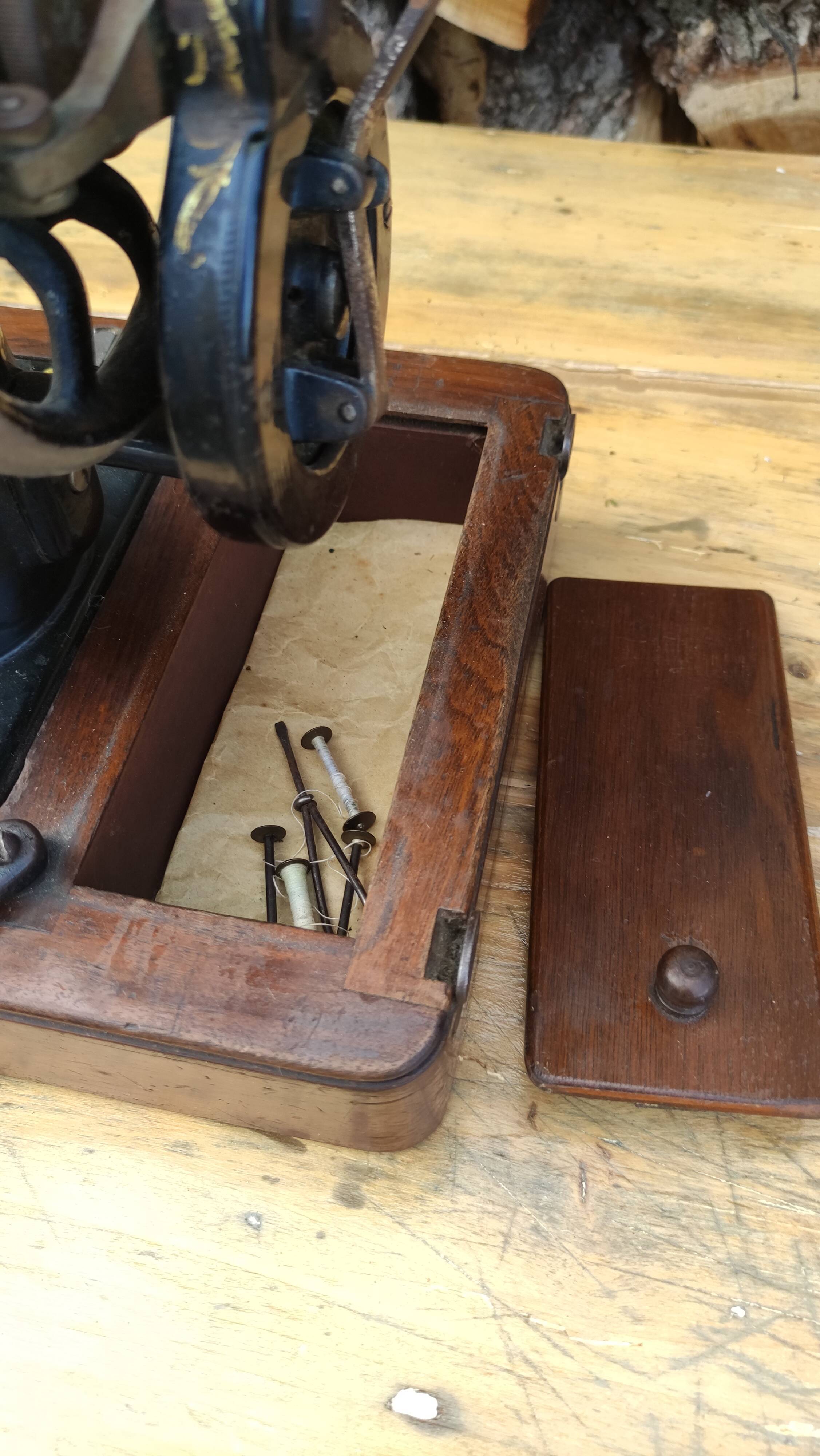 Old Singer sewing machine on its original base
