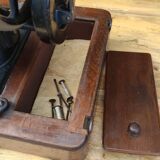 Old Singer sewing machine on its original base