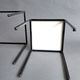 Pair of modernist nesting tables in black metal and white and black opaline 1960.