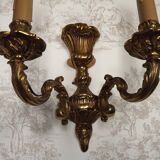 Pair of French baroque brass wall sconces with two branches, decorated with acanthus and wickerwork.