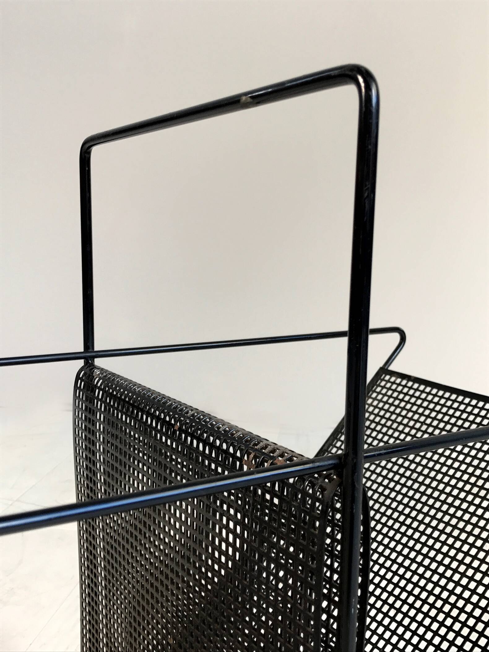 Perforated sheet metal magazine rack, 1960