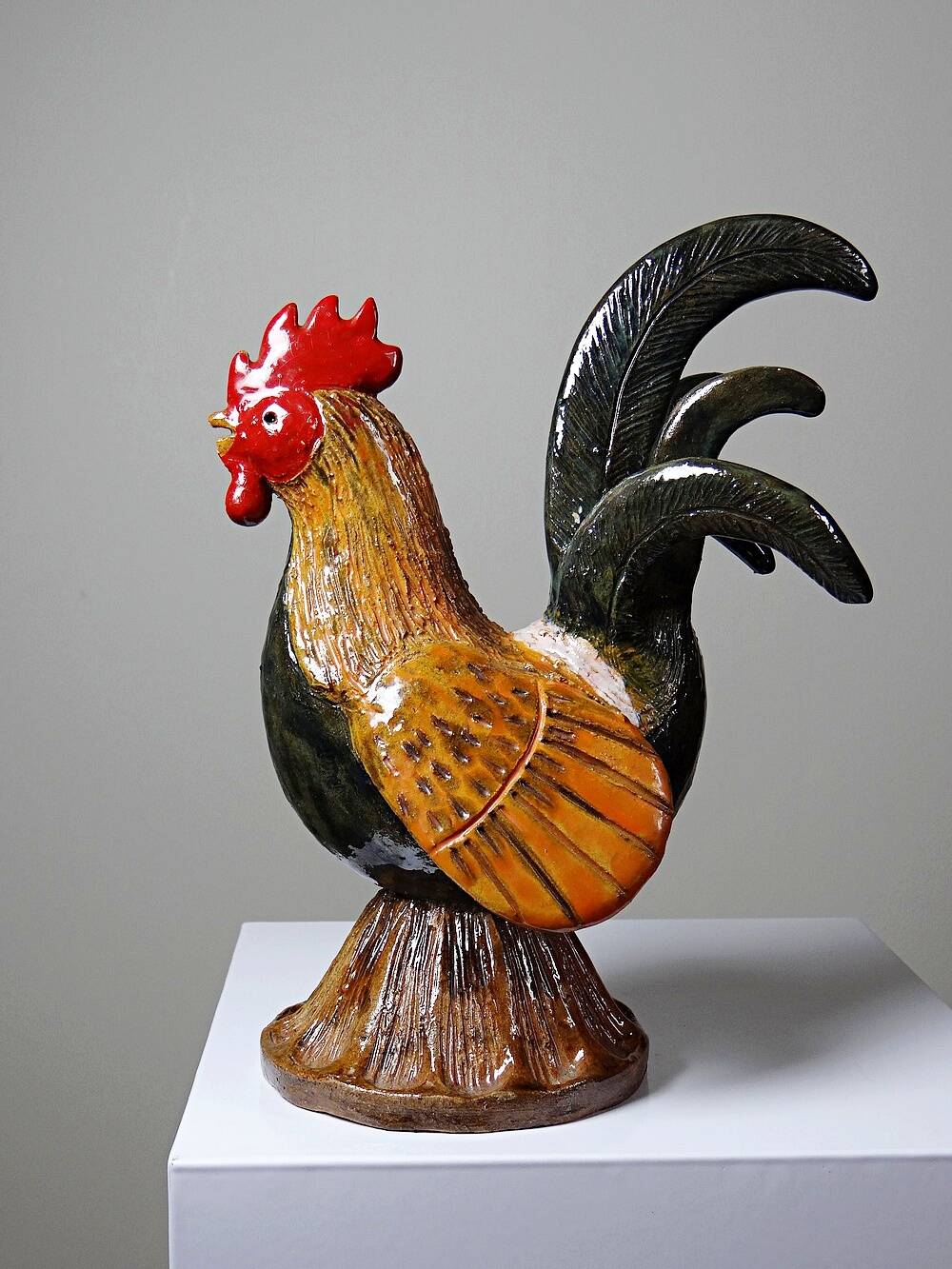 Small decorative rooster in handcrafted enameled ceramic folk art