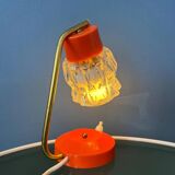 Small orange desk lamp with clear crystal glass shade