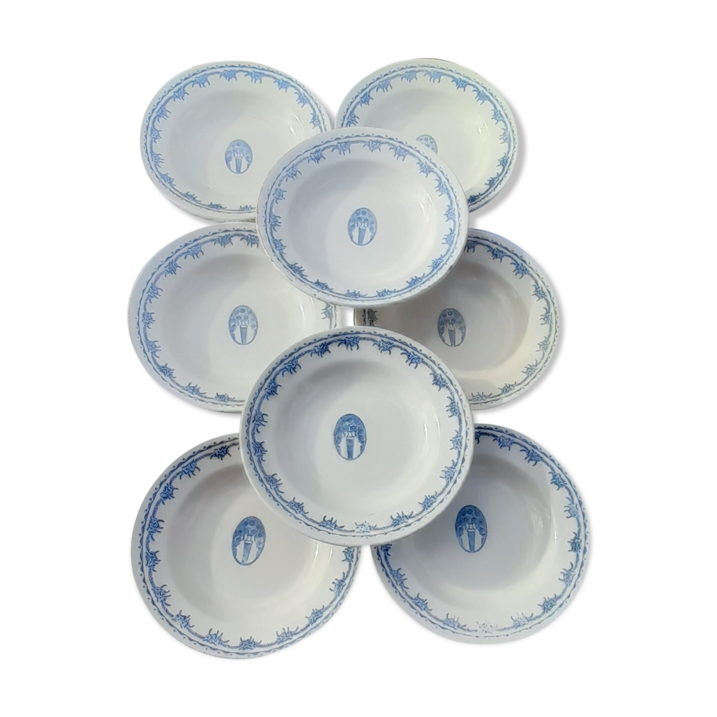 8 hollow plates in F J earthenware with frieze and central bouquet