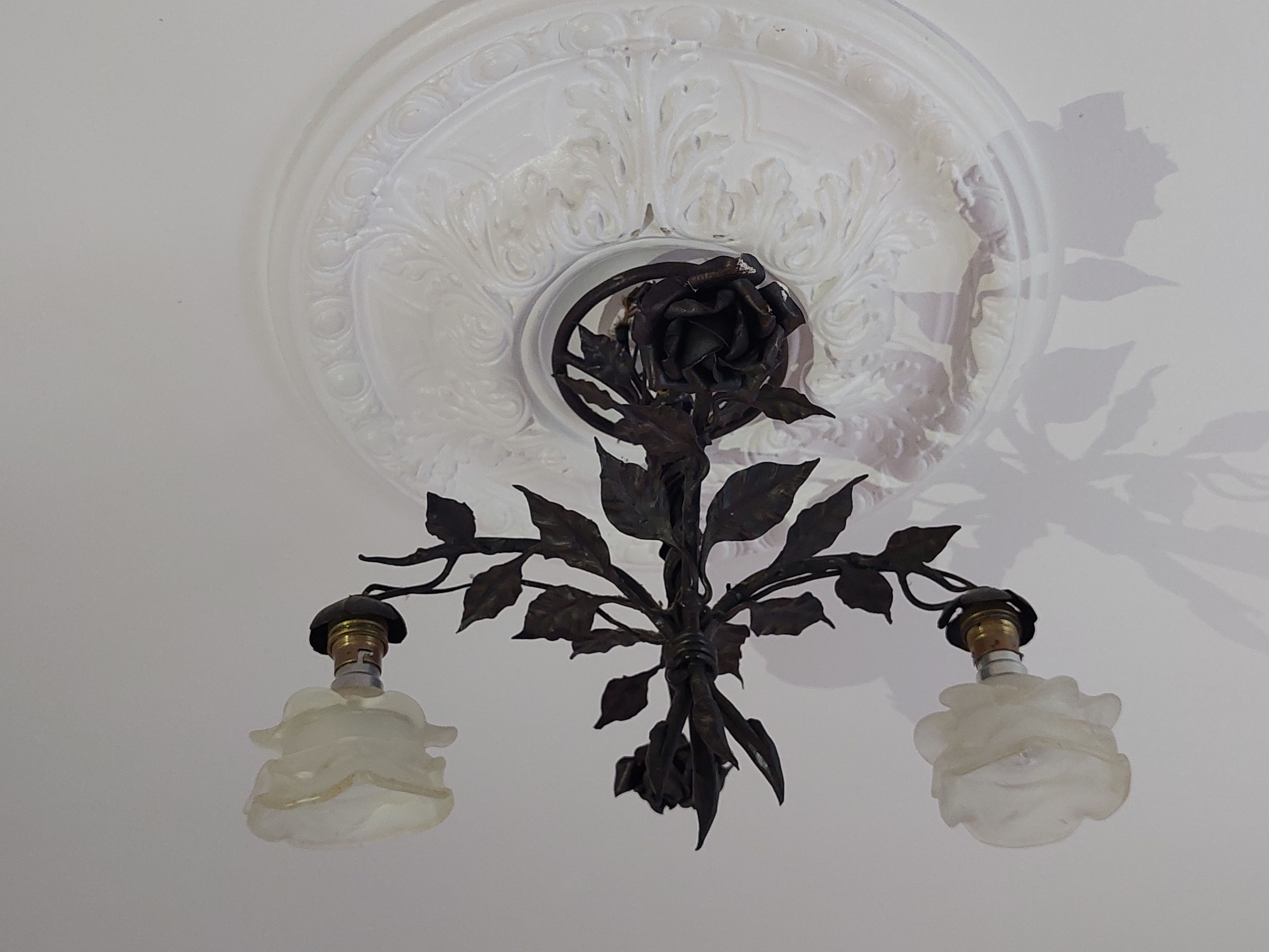 Chandelier with wrought iron and glass rose patterns