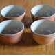 Lot of 4 bowls in sandstone and shiny grey inside