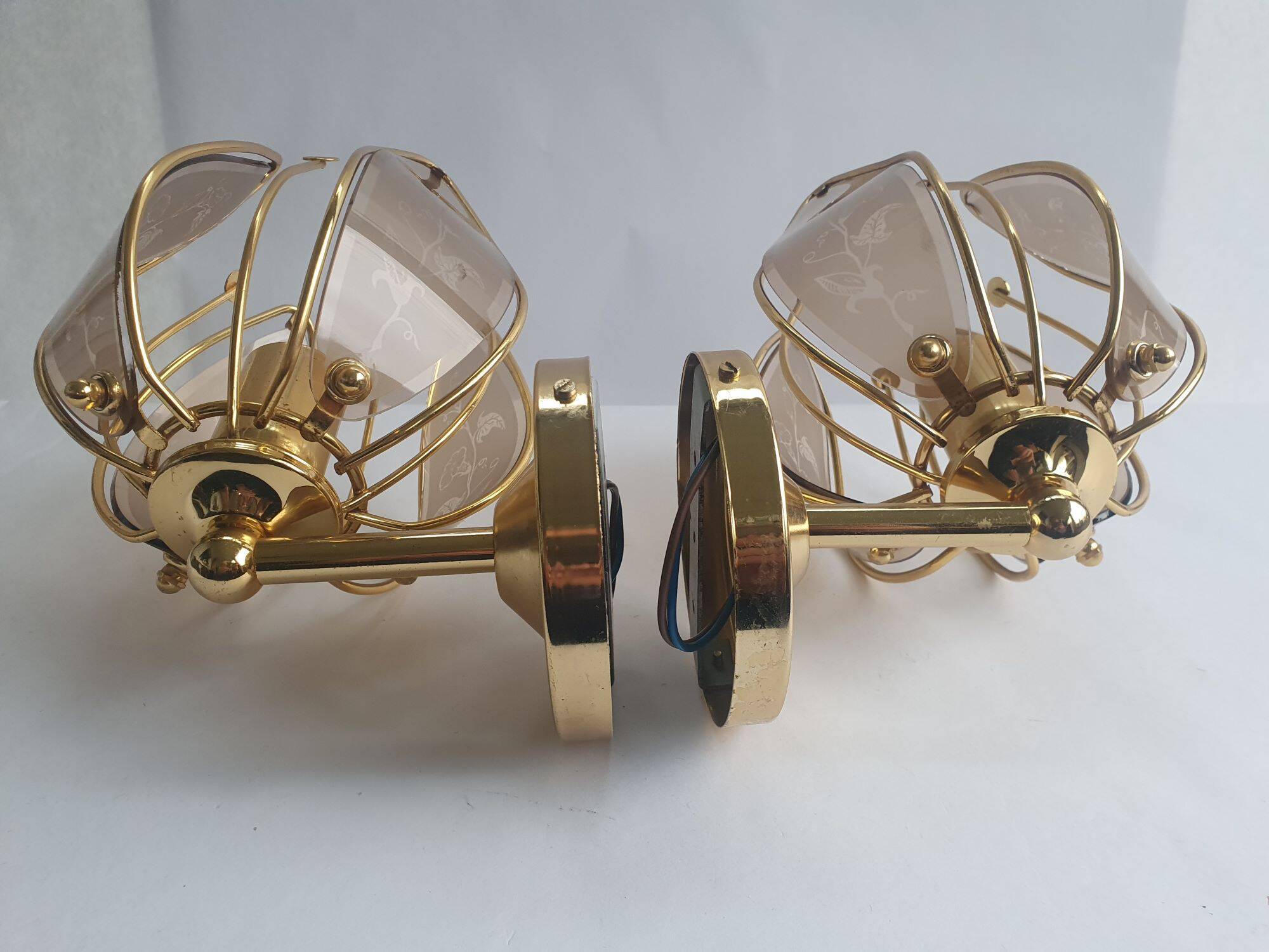 Pair of vintage brass wall sconces with glass shades