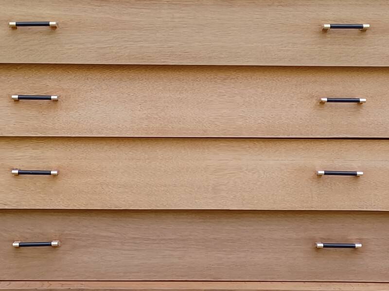 Renovated vintage commode from the 1960s in oak with slanted profile and tapered legs.