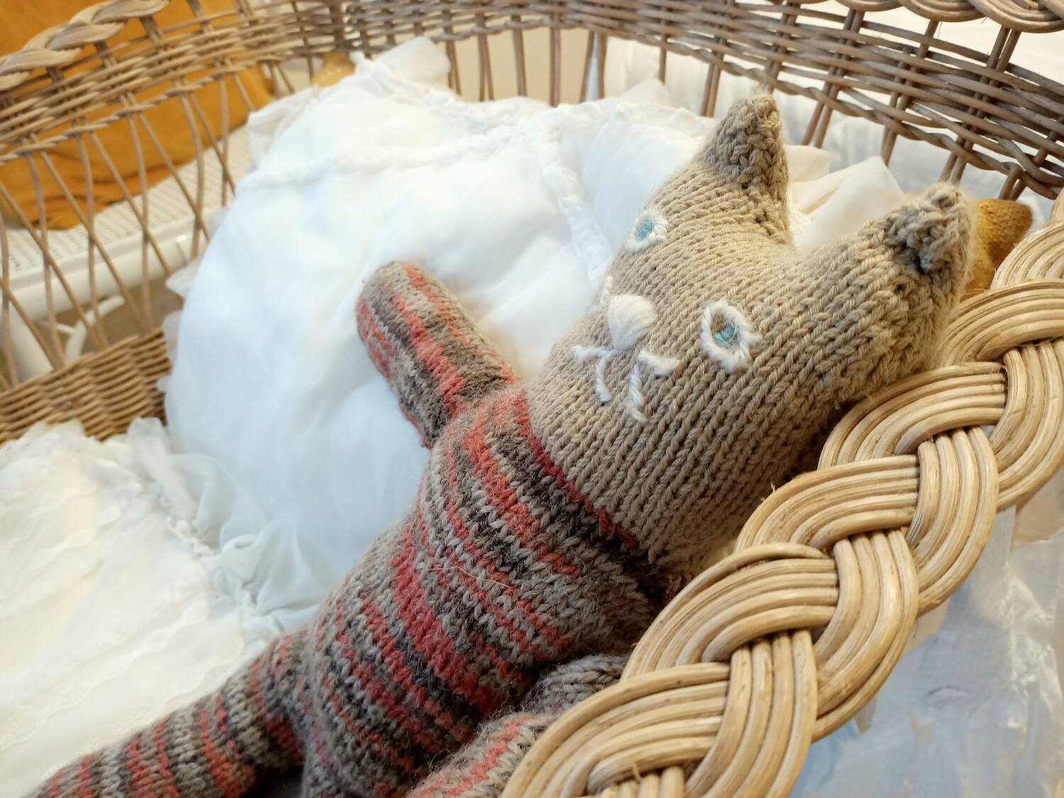 Rattan and wrought iron cradle