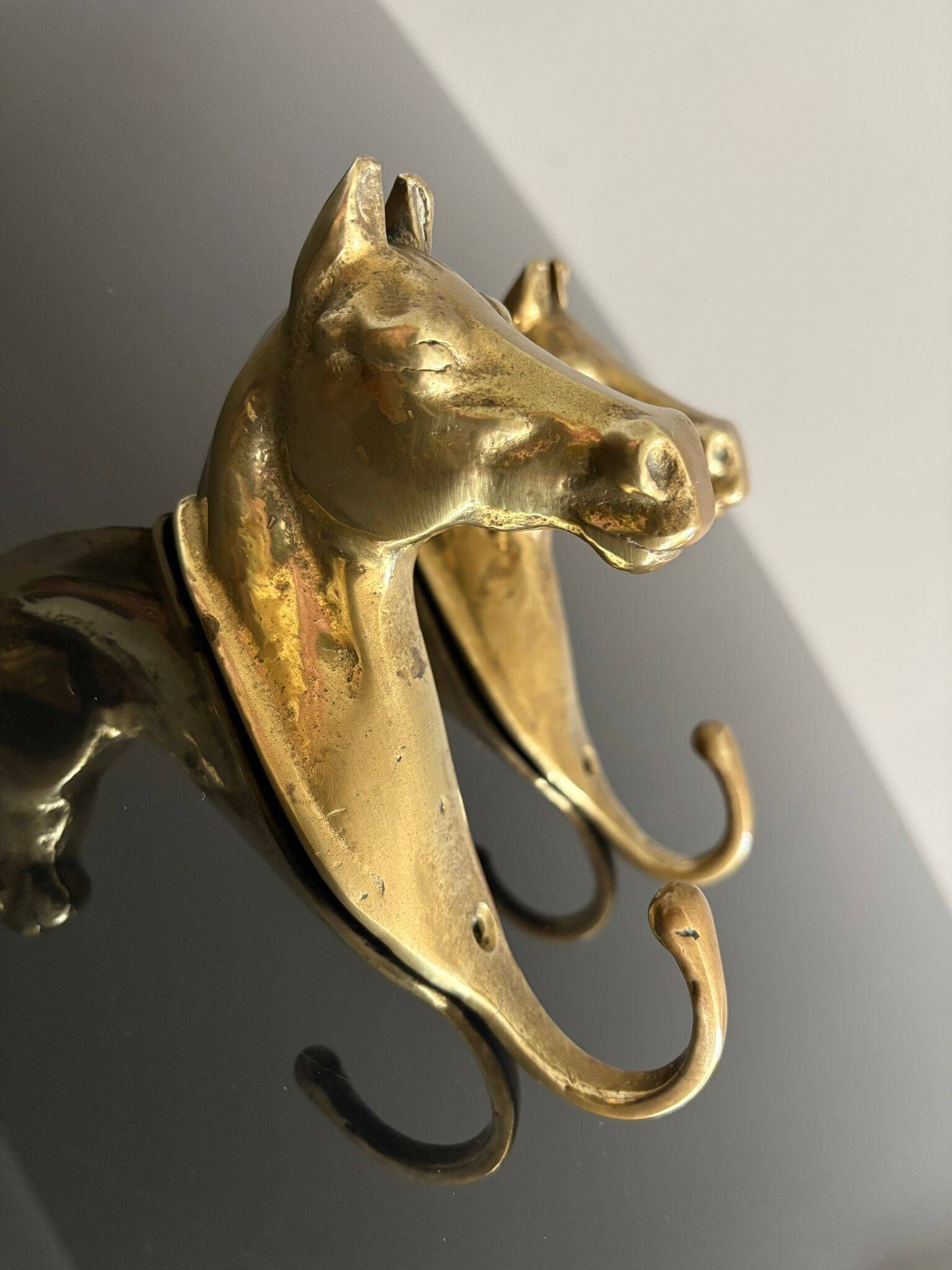 Pair of bronze coat hooks - Italy, 1950s