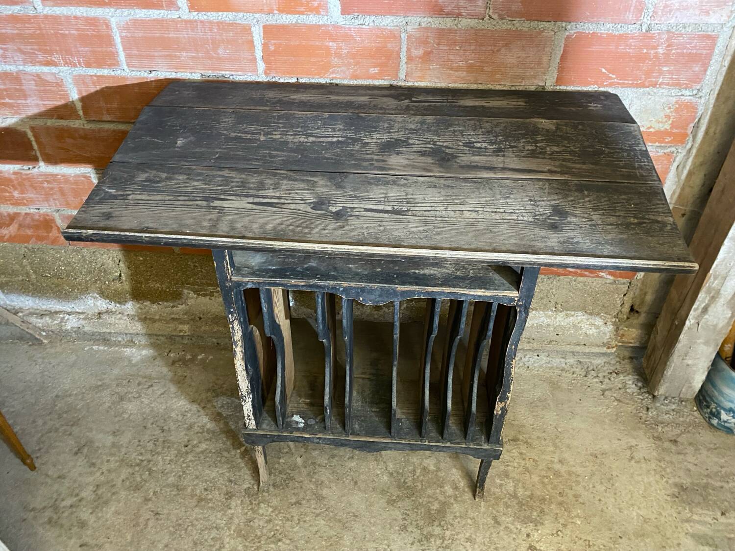 Antique writing desk, blackened wooden filing cabinet.