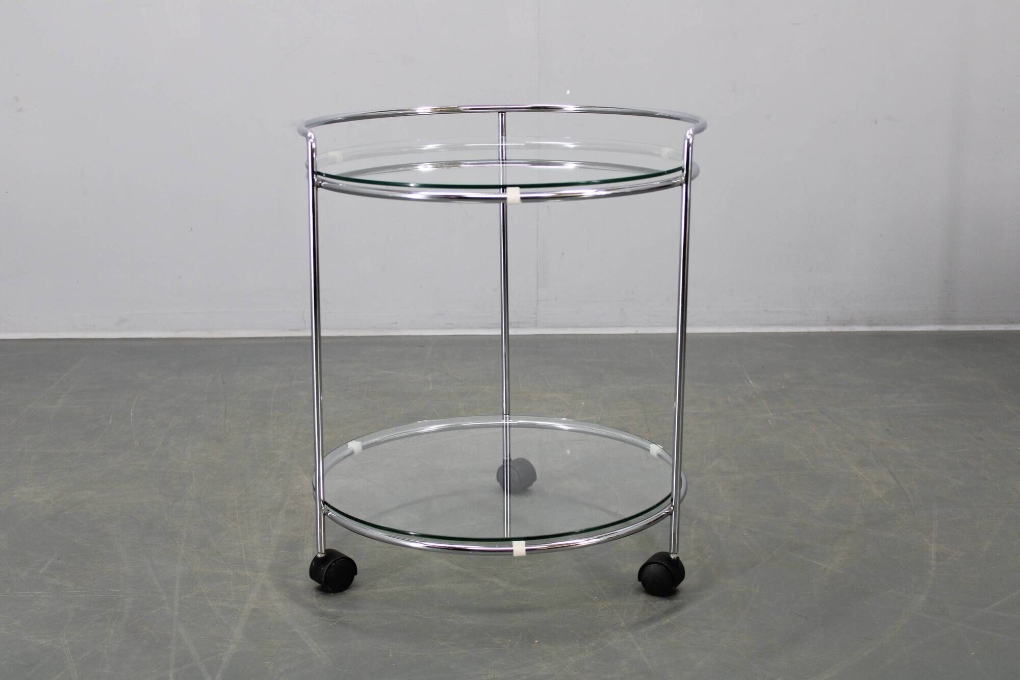Mid-century round serving table, chrome and glass, Italy, 1980s