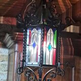 Wrought iron lantern with colored stained glass