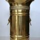 Hollywood Regency style umbrella stand, brass finish and lio pattern.
