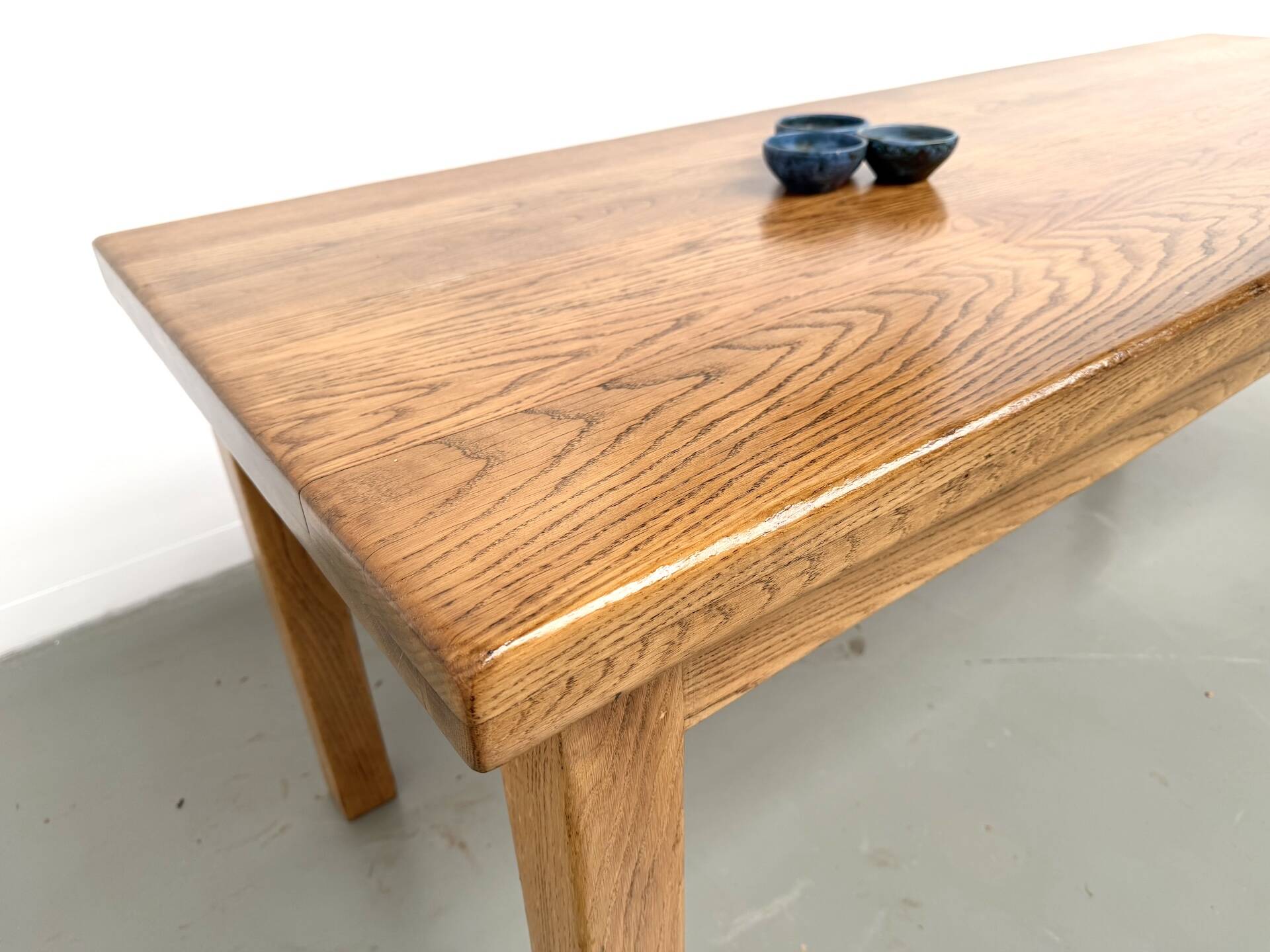 Solid oak farmhouse table, square legs.