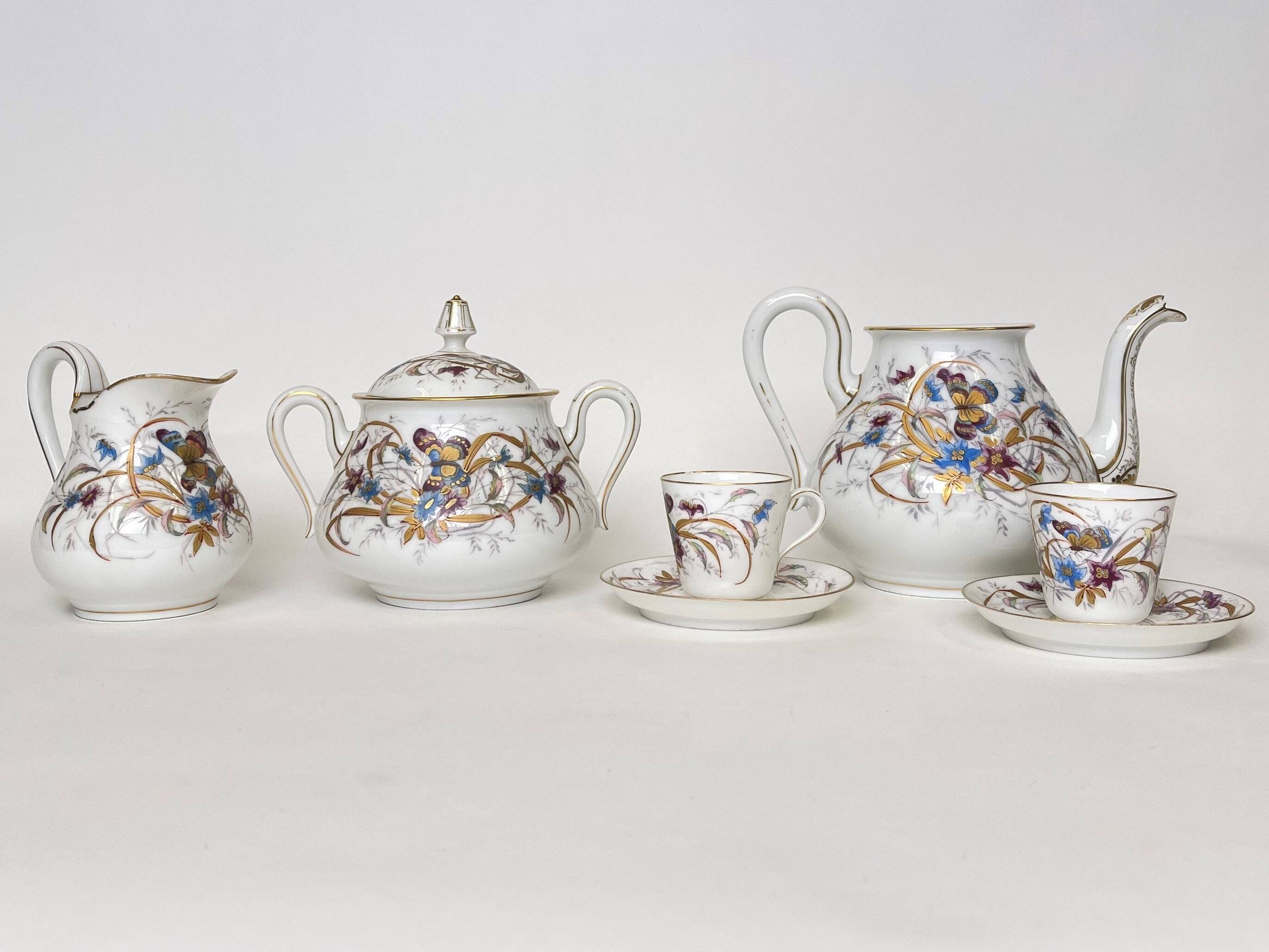 Porcelain tea service with floral and butterfly decorations, 25 pieces.