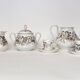 Porcelain tea service with floral and butterfly decorations, 25 pieces.
