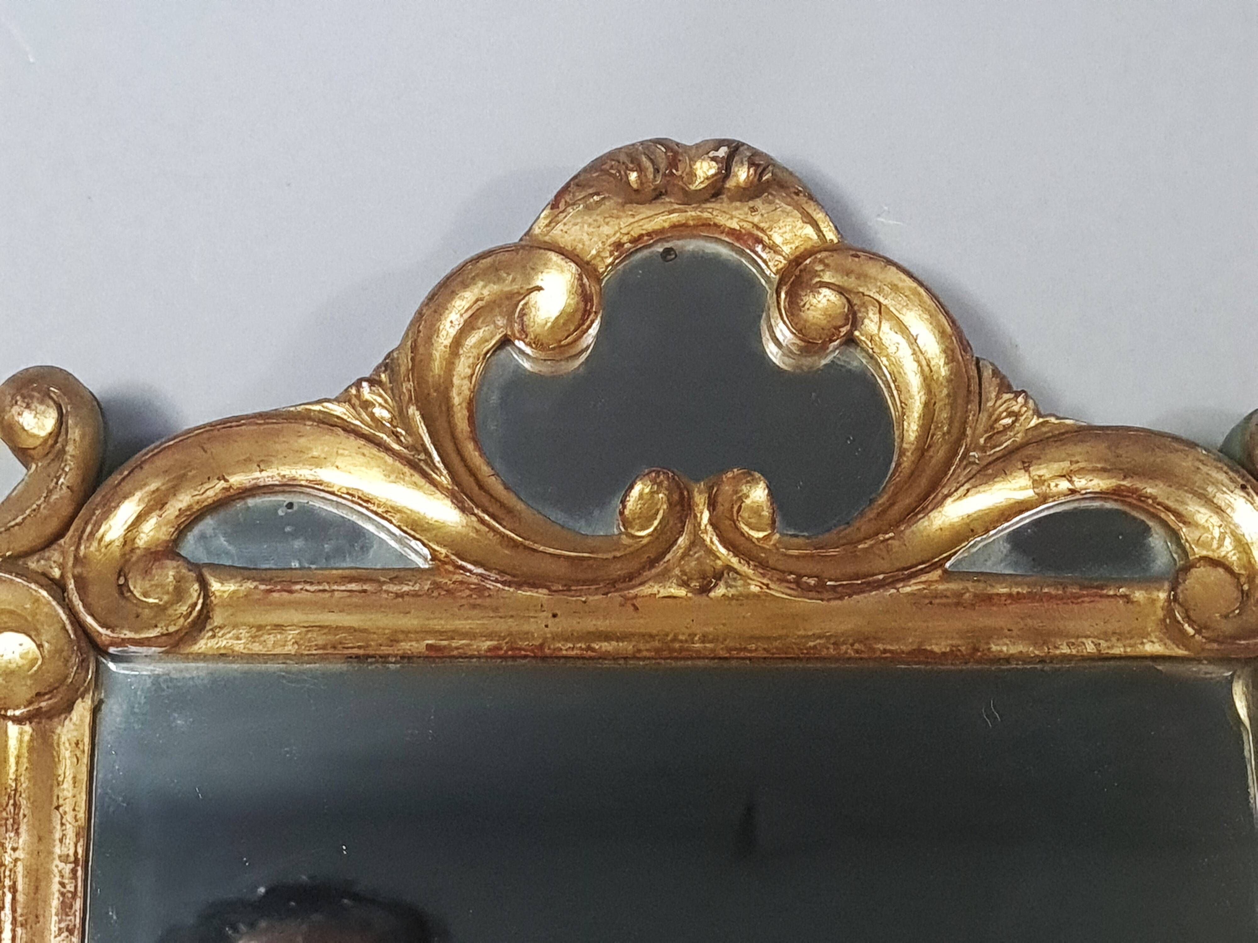 Antique mirror with carved wooden frame and original gilding, 53x37 cm, SD207.