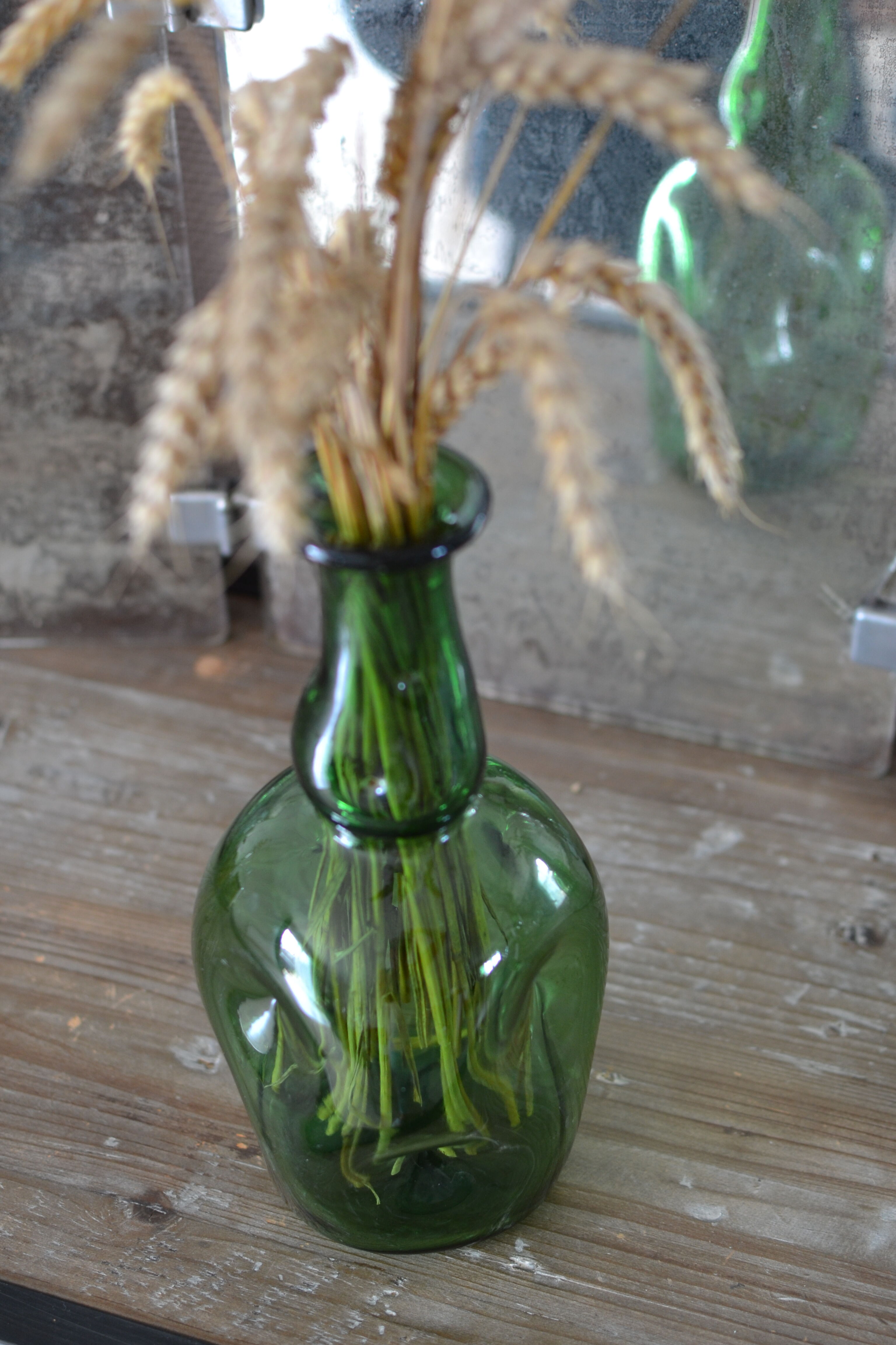 Dented green bottle