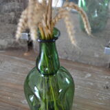 Dented green bottle