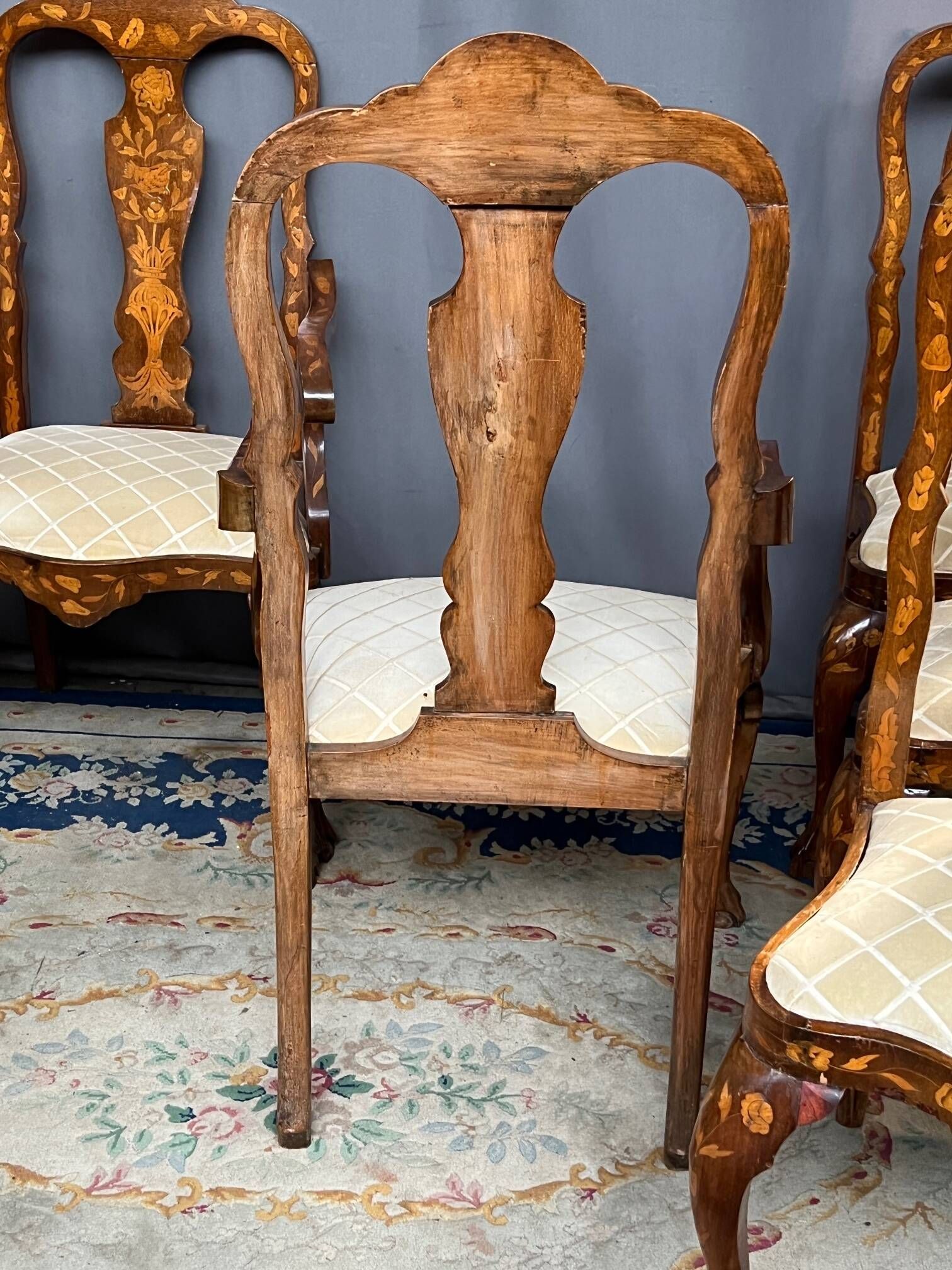 Set of two armchairs and six chairs. Marquetry with precious wood species.