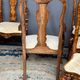 Set of two armchairs and six chairs. Marquetry with precious wood species.