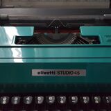 Studio 45 with his suitcase olivetti typewriter