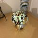Mosaic glass mushroom lamp in black, white, and amber.
