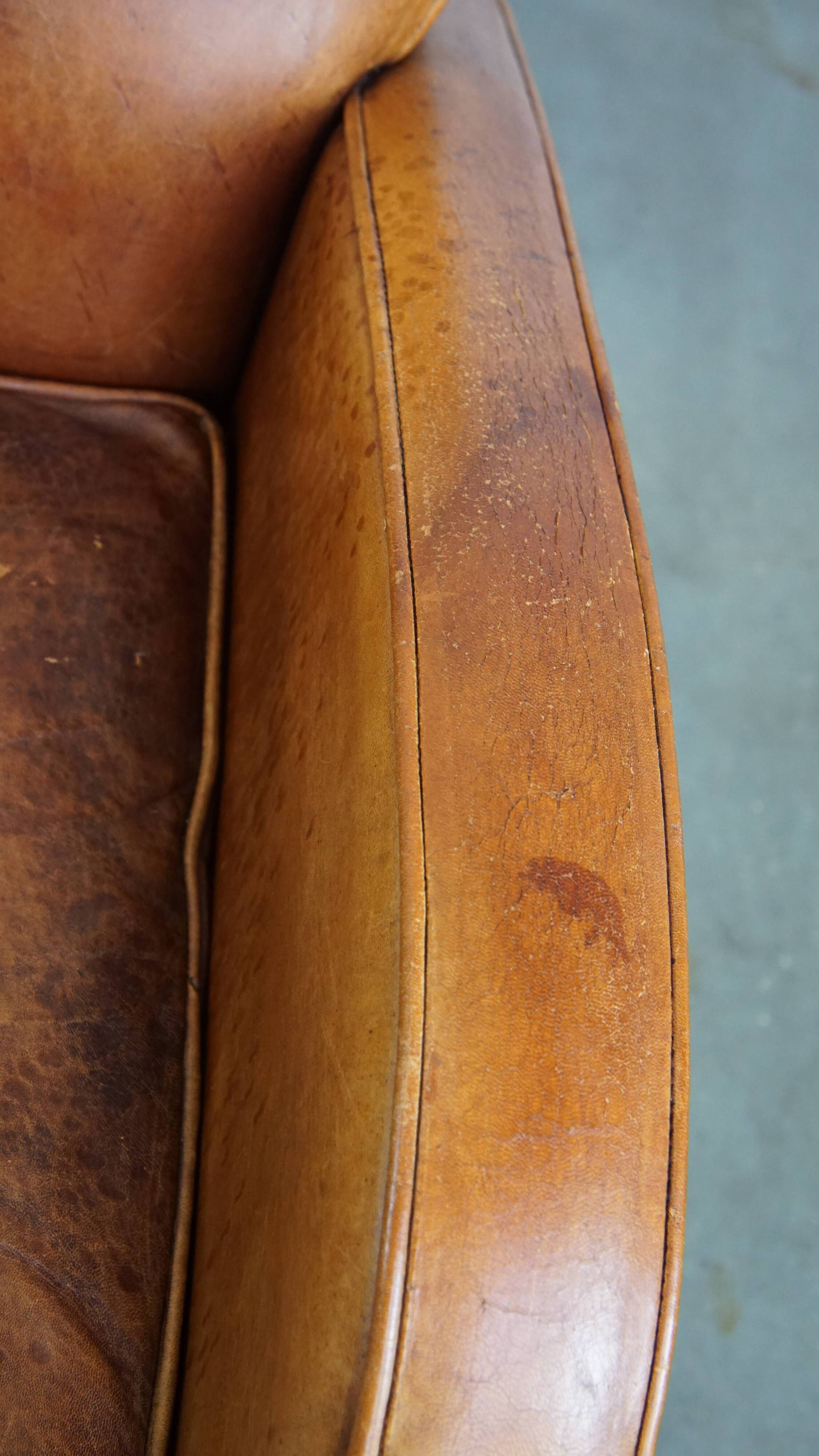 Characteristic sheepskin design armchair in beautiful warm cognac colours