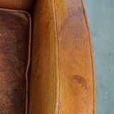 Characteristic sheepskin design armchair in beautiful warm cognac colours