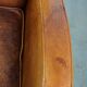 Characteristic sheepskin design armchair in beautiful warm cognac colours