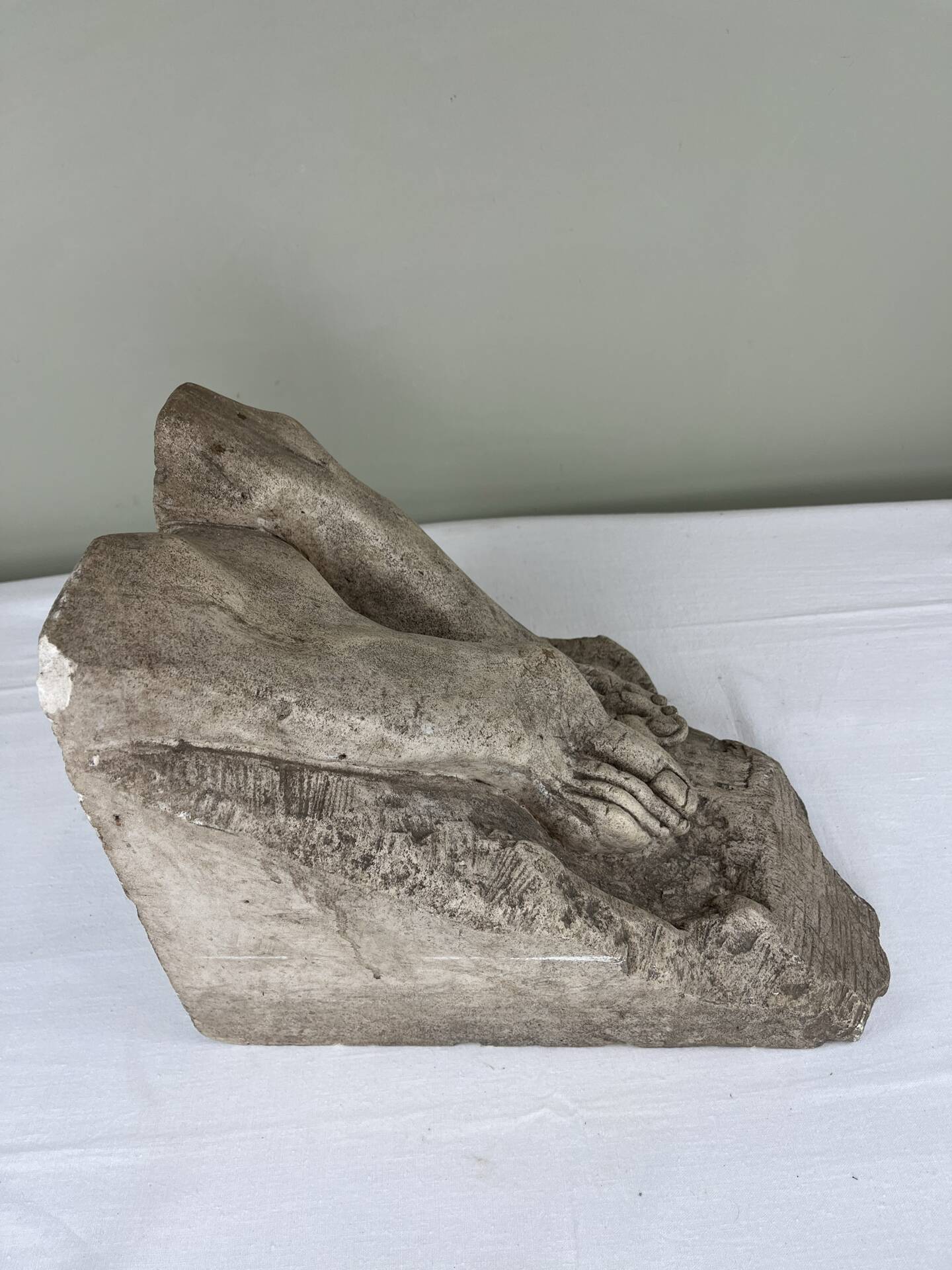 Stone sculpture, two feet on a block, signed D. Paillot.