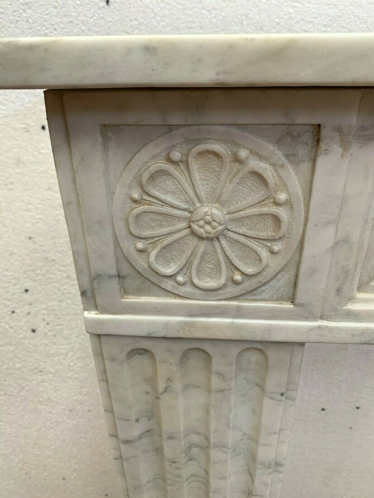 Louis XVI fireplace in 19th century white Carrara marble