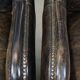 Set of 2 black cow leather armchairs finished with decorative nails, industrial style