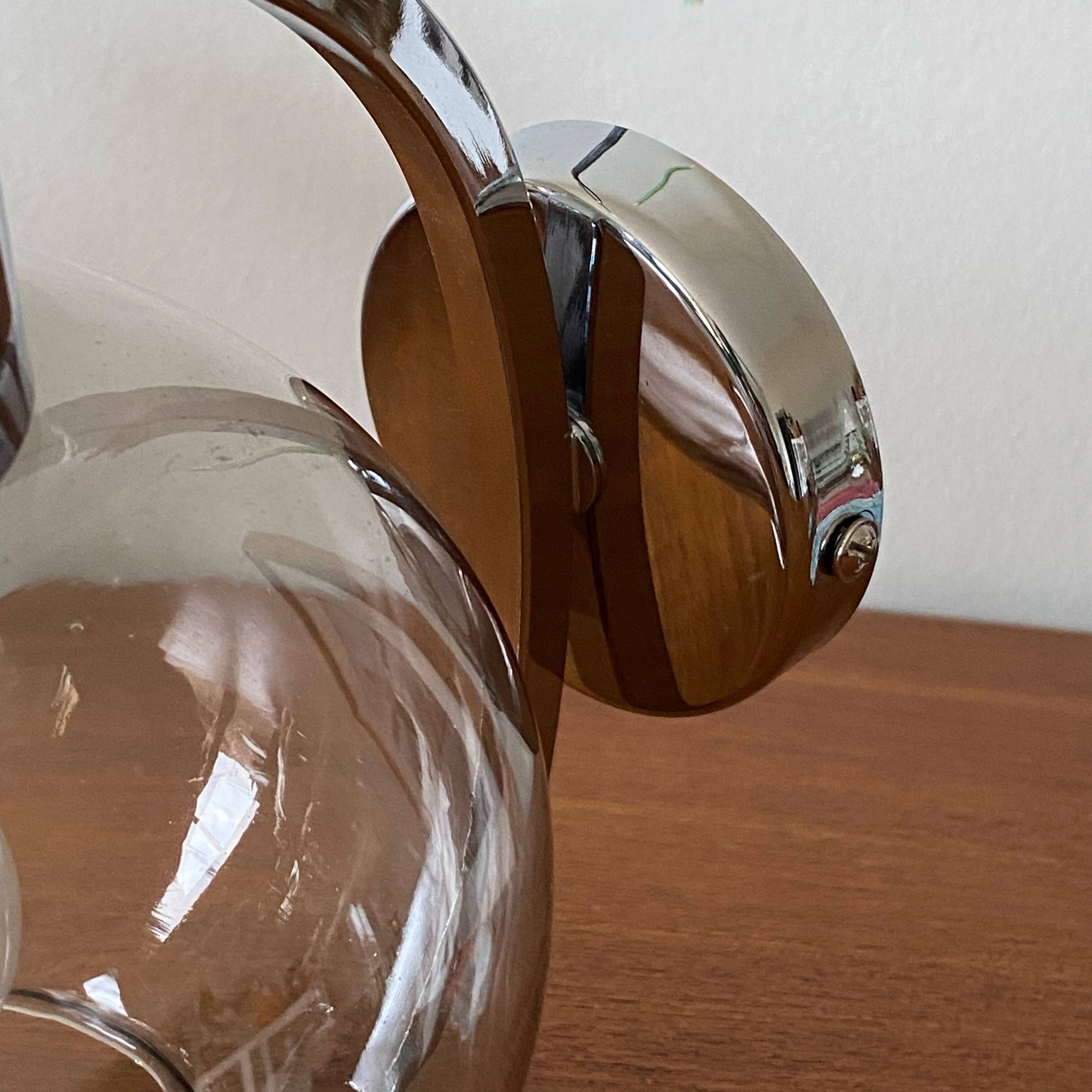 Wall light in chromed metal and smoked grey glass globe