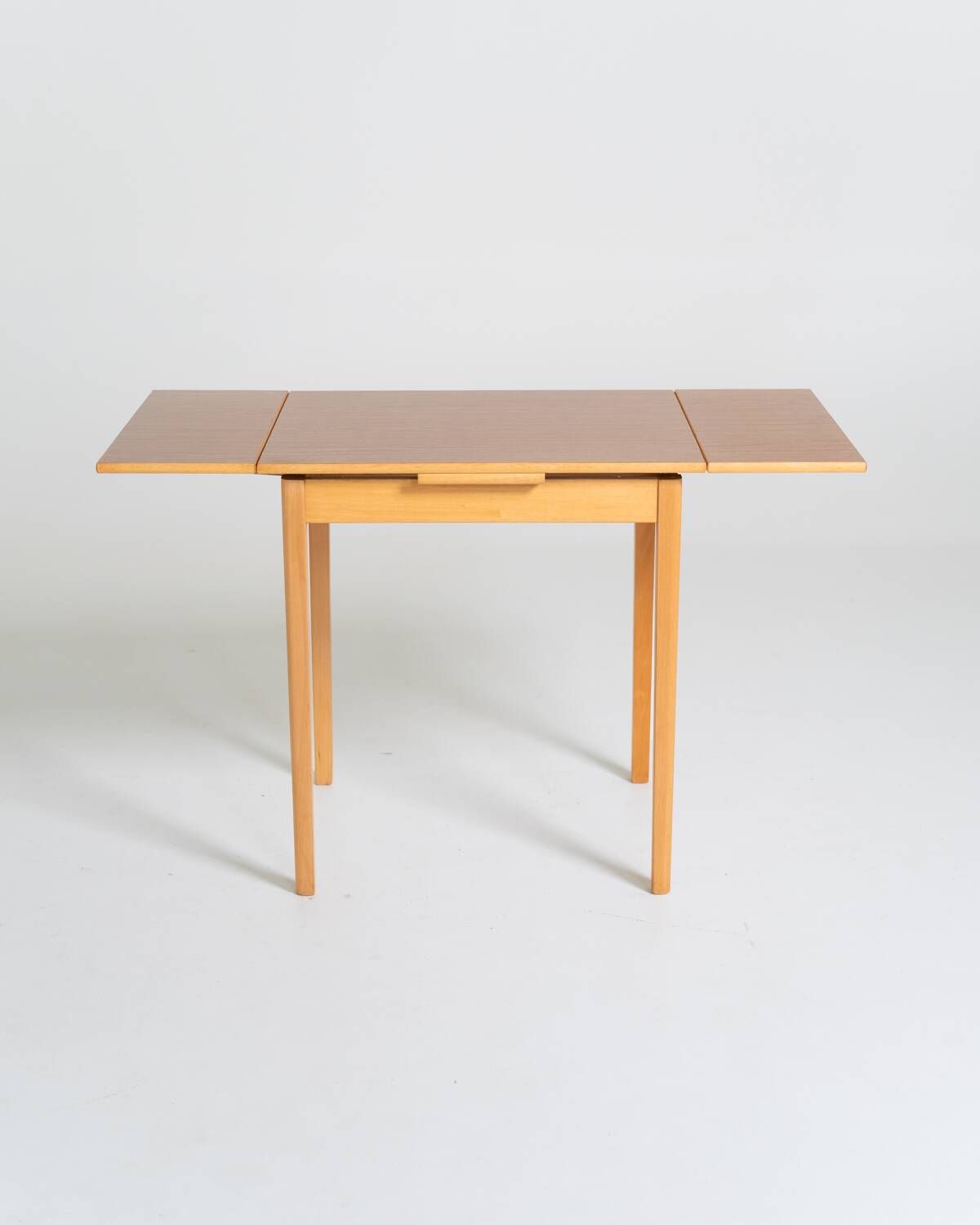 Extendable dining table in laminate and beech, Sweden, 1950s-60s
