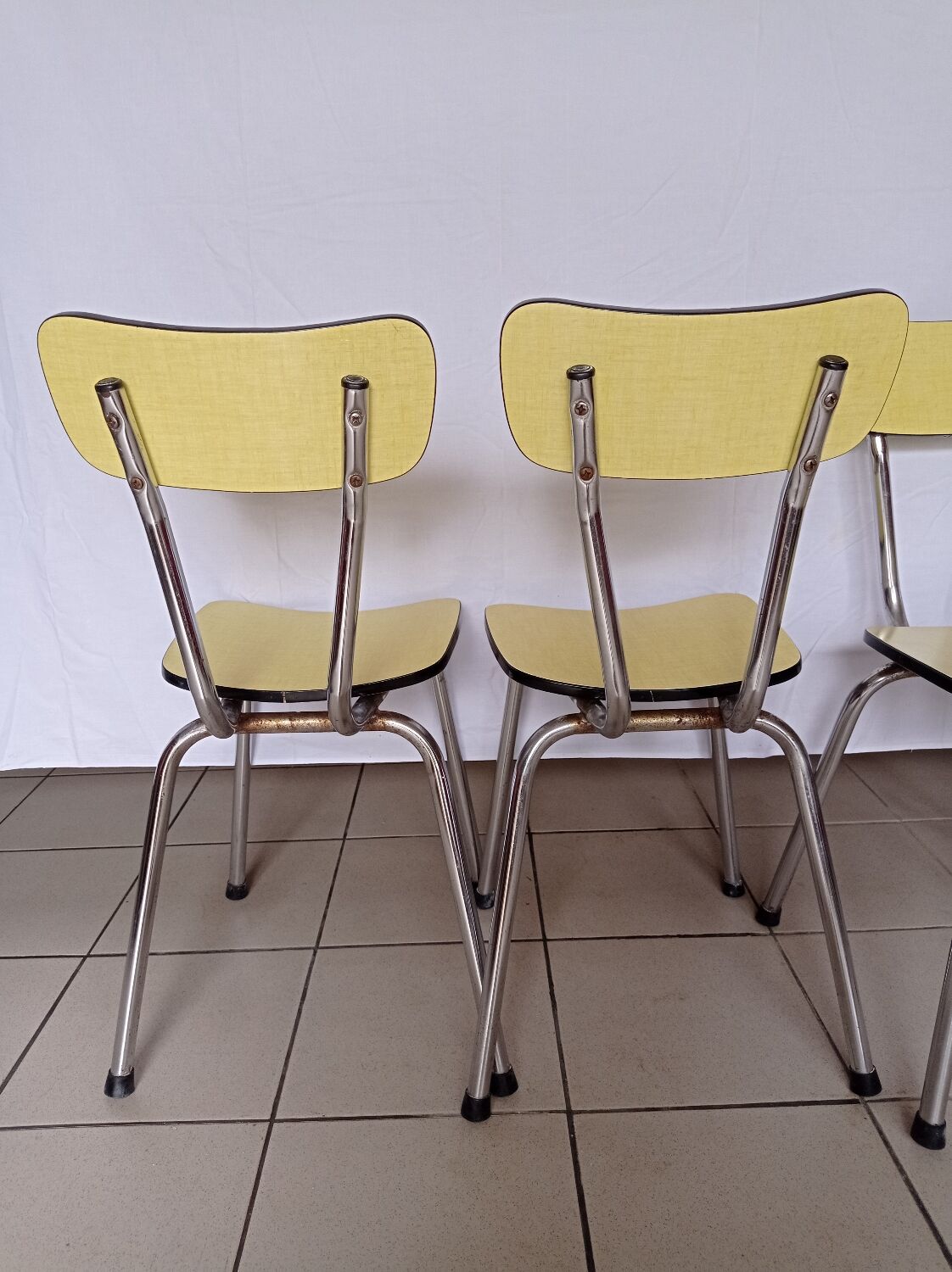 4 yellow Formica chairs
