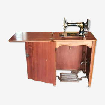 Antique sewing machine and its furniture