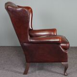 Leather armchair with decorative nails