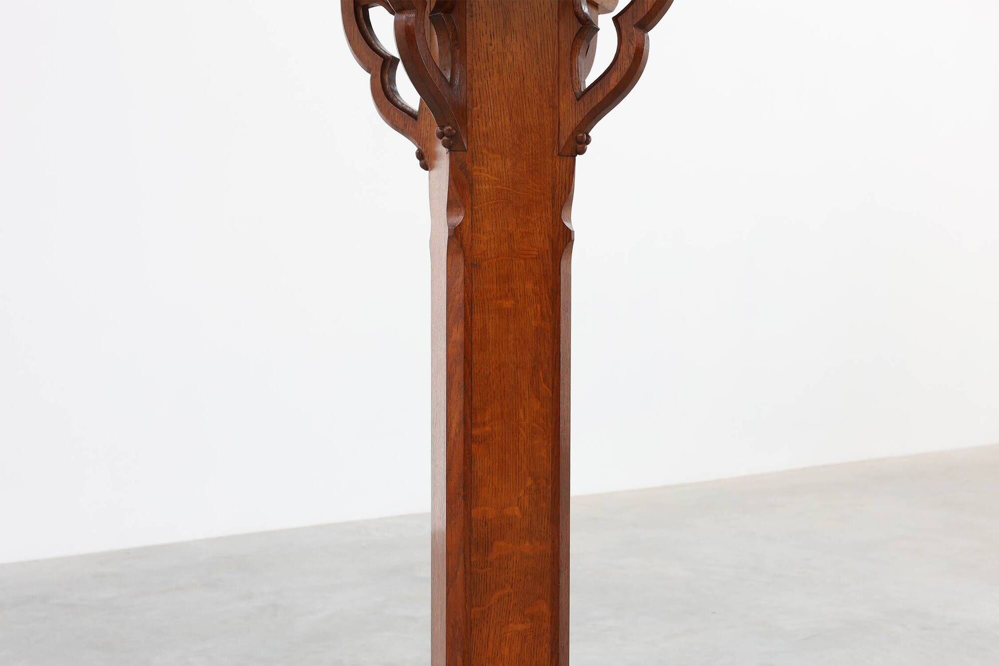 Art Deco oak pedestal with pierced brackets and cross base, Belgium 1920s