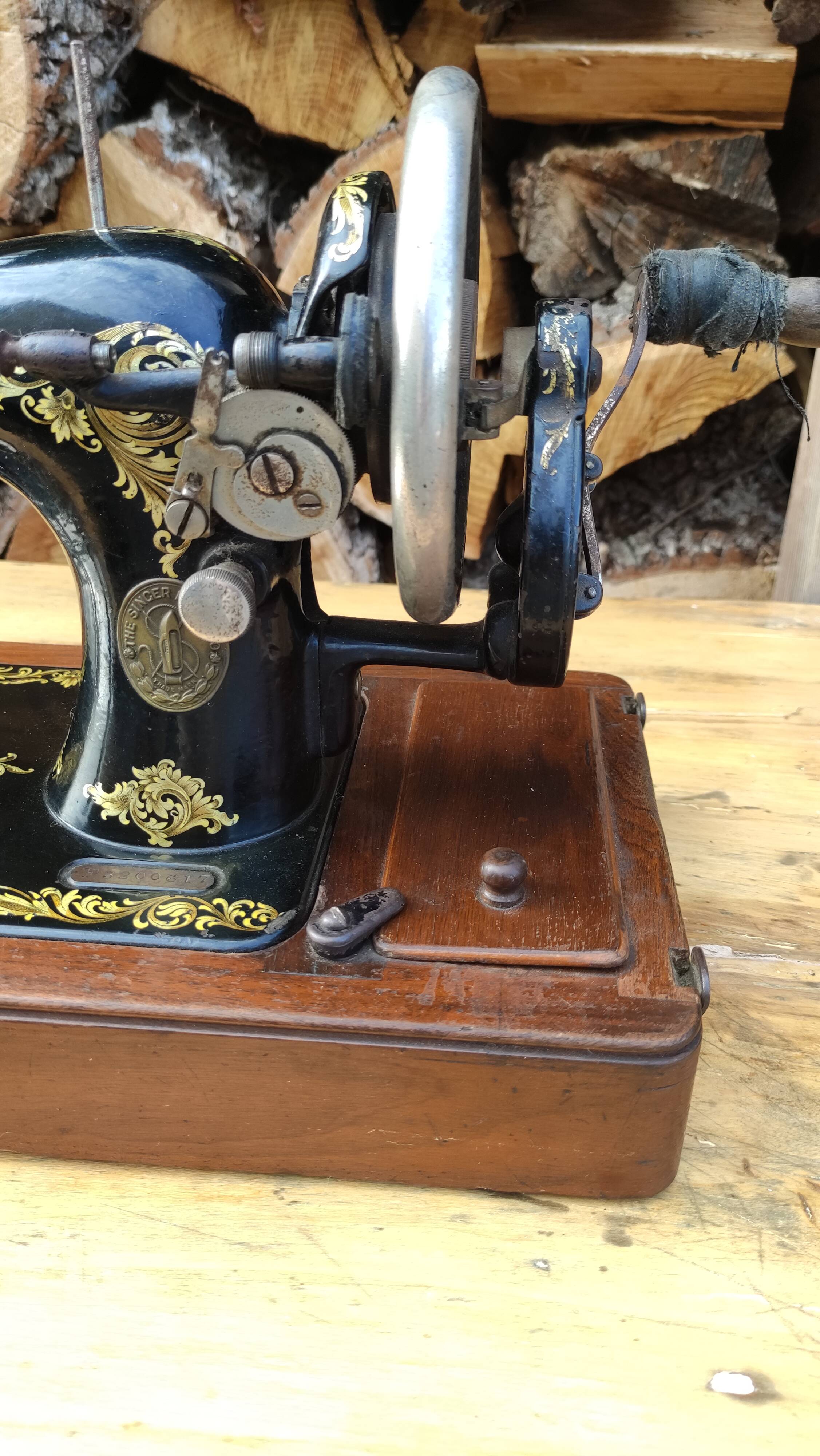 Old Singer sewing machine on its original base