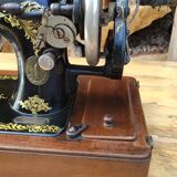 Old Singer sewing machine on its original base
