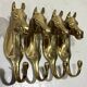 Brass horses coat hooks 1960’s, set of 4