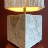Beige marble stucco base, Houles white ecru fringed lampshade.